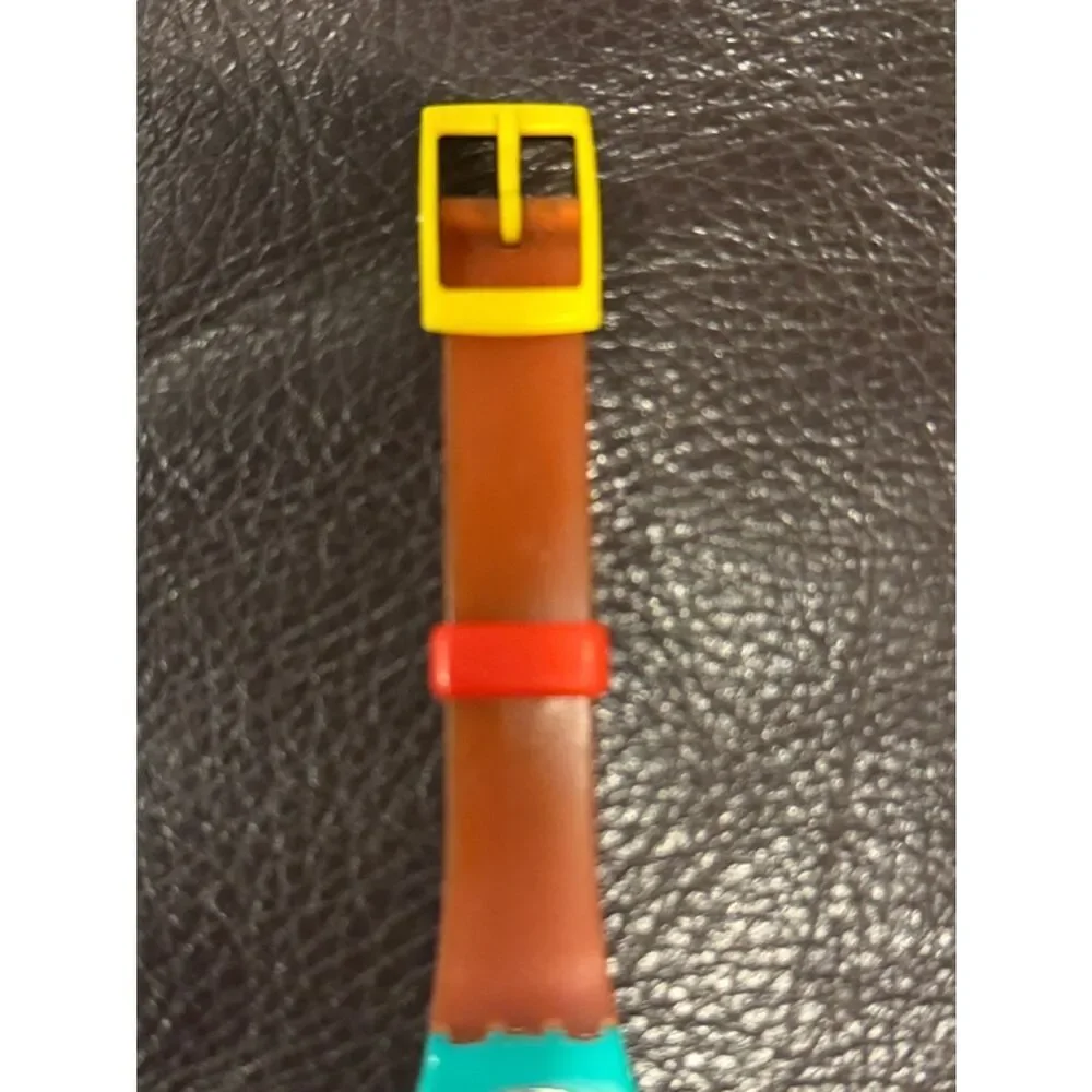 Vintage 1986 Swatch Lady HORUS LL101 Watch – Teal Case, Orange Hieroglyph Dial